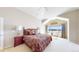 Bedroom featuring a large bed, waterfront views, and a cozy atmosphere at 1738 Edgewater Pl, Longmont, CO 80504