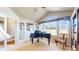 Bright music room featuring a piano and large windows, perfect for enjoying natural light at 1738 Edgewater Pl, Longmont, CO 80504