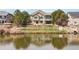 Back of house view showcasing the waterfront backyard and patio area at 1738 Edgewater Pl, Longmont, CO 80504