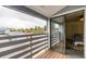 Balcony with views of trees and a sliding door to the bedroom at 7665 E Eastman Ave # 202A, Denver, CO 80231