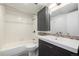 Full bathroom featuring modern sink, shower and tub combination, and storage cabinet at 7665 E Eastman Ave # 202A, Denver, CO 80231