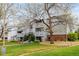 A well-manicured lawn and building exteriors featuring private patios, perfect for outdoor relaxation at 7665 E Eastman Ave # 202A, Denver, CO 80231