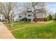 Landscaped community featuring well-maintained building exteriors with private patios and lush green spaces at 7665 E Eastman Ave # 202A, Denver, CO 80231