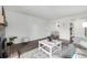 Comfortable living room shows entry and dining area at 7665 E Eastman Ave # 202A, Denver, CO 80231