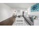 Spacious living room leading to dining area, kitchen, with lots of natural light at 7665 E Eastman Ave # 202A, Denver, CO 80231