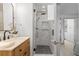 Modern bathroom with a walk-in shower, marble vanity, and stylish fixtures at 3756 Decatur St, Denver, CO 80211