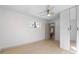 Spacious bedroom with light wood floors, large closet, and ceiling fan at 3756 Decatur St, Denver, CO 80211