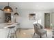 Modern kitchen with white cabinets and a large island at 3756 Decatur St, Denver, CO 80211