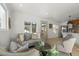 Bright living room featuring a comfy sofa and accent chairs at 3756 Decatur St, Denver, CO 80211