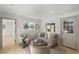 Light-filled living room with a gray sofa and coffee table at 3756 Decatur St, Denver, CO 80211