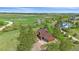 Overhead view of a cozy home with an attached garage, bordered by tall trees and sprawling green lawns at 3163 Windstream Ln, Elizabeth, CO 80107