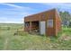 Rustic barn offering storage space and rural charm on a well-maintained property at 3163 Windstream Ln, Elizabeth, CO 80107