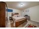 Bedroom featuring a large bed, wood accents, and a comfortable atmosphere at 3163 Windstream Ln, Elizabeth, CO 80107