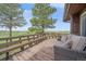 Inviting deck with wooden railing offering panoramic views and comfortable seating for outdoor enjoyment at 3163 Windstream Ln, Elizabeth, CO 80107