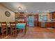 Bright dining area with wood cabinets, stainless appliances, and hardwood floors for a cozy feel at 3163 Windstream Ln, Elizabeth, CO 80107