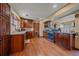 Functional kitchen with granite counters, wood cabinets, stainless appliances, and hardwood floors at 3163 Windstream Ln, Elizabeth, CO 80107