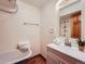 Charming bathroom with a clawfoot tub, modern vanity, and a decorative plant at 23231 Maricopa Rd, Indian Hills, CO 80454