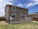 Exterior view featuring a spacious deck and well-maintained lawn, ideal for entertaining at 317 Whimsical Ave, Brighton, CO 80603