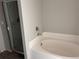 A bathroom featuring a bathtub and glass shower at 317 Whimsical Ave, Brighton, CO 80603