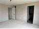 This is a bedroom with a door leading to a bathroom at 317 Whimsical Ave, Brighton, CO 80603