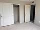 This is a bedroom with sliding closet doors and a door at 317 Whimsical Ave, Brighton, CO 80603