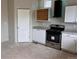 Bright kitchen featuring white cabinets, granite countertops, and stainless steel appliances at 317 Whimsical Ave, Brighton, CO 80603