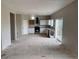 Bright kitchen featuring white cabinets, stainless steel appliances, and sliding glass door access to the back deck at 317 Whimsical Ave, Brighton, CO 80603