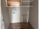 Functional laundry room with built in shelving and utility connections, ready for appliances at 317 Whimsical Ave, Brighton, CO 80603