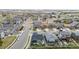 A residential neighborhood with well-maintained homes, manicured lawns, and street parking at 10595 Boston St, Commerce City, CO 80640