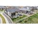 A fenced backyard with outdoor patio seating and a well-maintained lawn at 10595 Boston St, Commerce City, CO 80640