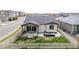 The backyard features a patio with comfortable furniture, a manicured lawn, and a privacy fence at 10595 Boston St, Commerce City, CO 80640