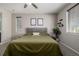 Bedroom featuring a queen-sized bed, and calming, neutral color palette at 10595 Boston St, Commerce City, CO 80640