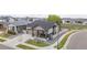 Charming single-Gathering home featuring manicured landscaping, stone accents, and a welcoming front porch at 10595 Boston St, Commerce City, CO 80640