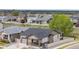 Charming single-Gathering home featuring a two-car garage, porch, and neutral-toned siding with a well-manicured lawn at 10595 Boston St, Commerce City, CO 80640
