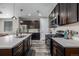 Modern kitchen featuring stainless steel appliances, sleek countertops, and ample cabinet space at 10595 Boston St, Commerce City, CO 80640
