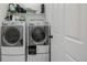 Laundry room with new-looking front-load washer and dryer at 10595 Boston St, Commerce City, CO 80640