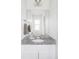Bright bathroom featuring granite counters, and decorative elements at 2862 S Galapago Ct, Englewood, CO 80110