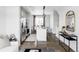 A modern, neutral kitchen flows into the dining area, featuring stainless steel appliances and a granite island with seating at 2862 S Galapago Ct, Englewood, CO 80110