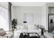 The living room has a white couch, artwork, and a large window at 2862 S Galapago Ct, Englewood, CO 80110