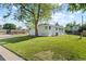 Spacious backyard and well-maintained lawn behind the house at 12017 W 58Th Pl, Arvada, CO 80004