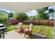 Charming backyard patio with outdoor seating under a covered awning at 12017 W 58Th Pl, Arvada, CO 80004