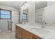 Elegant bathroom with double sinks, modern fixtures, and ample counter space at 12017 W 58Th Pl, Arvada, CO 80004