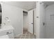 Bright bathroom featuring a shower, sink, patterned tile flooring and an open closet at 12017 W 58Th Pl, Arvada, CO 80004
