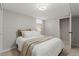 Clean bedroom with a white bed and neutral tones creating a calming retreat at 12017 W 58Th Pl, Arvada, CO 80004