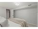 Cozy bedroom showcasing a neatly made bed and ample natural light at 12017 W 58Th Pl, Arvada, CO 80004
