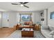 Cozy living room with large windows and stylish furniture at 12017 W 58Th Pl, Arvada, CO 80004