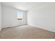 Bright bedroom features neutral carpet, fresh paint and large window allowing natural light at 6636 N Nepal St, Aurora, CO 80019