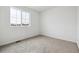 Bedroom features neutral carpet, fresh paint and large window allowing natural light at 6636 N Nepal St, Aurora, CO 80019