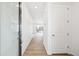 Bright entryway features wood-look flooring and a glass-paneled front door for welcoming natural light at 6636 N Nepal St, Aurora, CO 80019