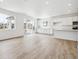 Light-filled open-concept living room with modern finishes and sliding glass doors to the outside at 6636 N Nepal St, Aurora, CO 80019